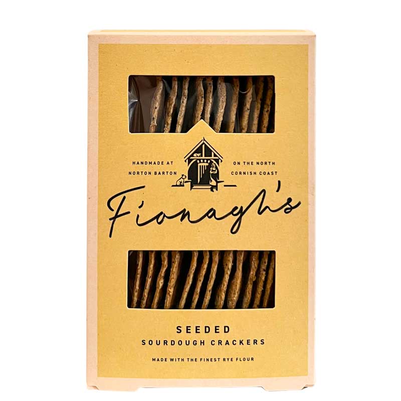 A 100g pack of Fionagh's Seeded Sourdough Crackers in a light tan cardboard box with two clear windows showing the crackers inside.
