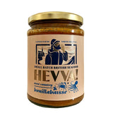 A 470g glass jar of 'HEVVA! West country bouillabaisse' jarred British seafood, featuring a beige label with a navy blue illustration of a fisherman and a gold metal lid, set against a plain white background.