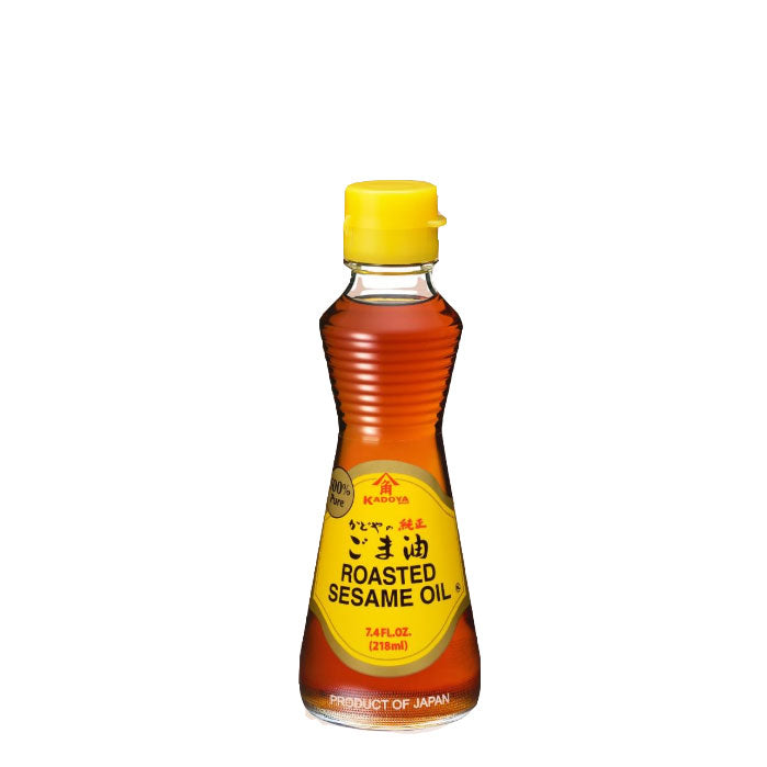 A bottle of Kadoya Gold Roasted Sesame Oil in a 218ml bottle on a white ackground