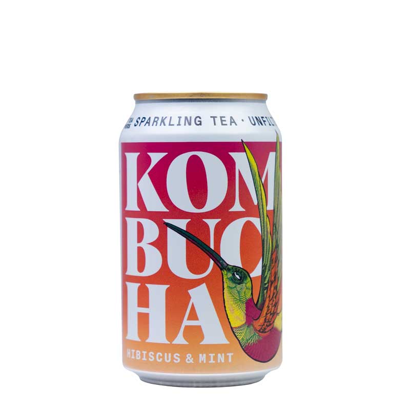 An orange and pink can of Nania's Hibiscus & Mint Kombucha with an attractive illustrated humming bird on a white background.