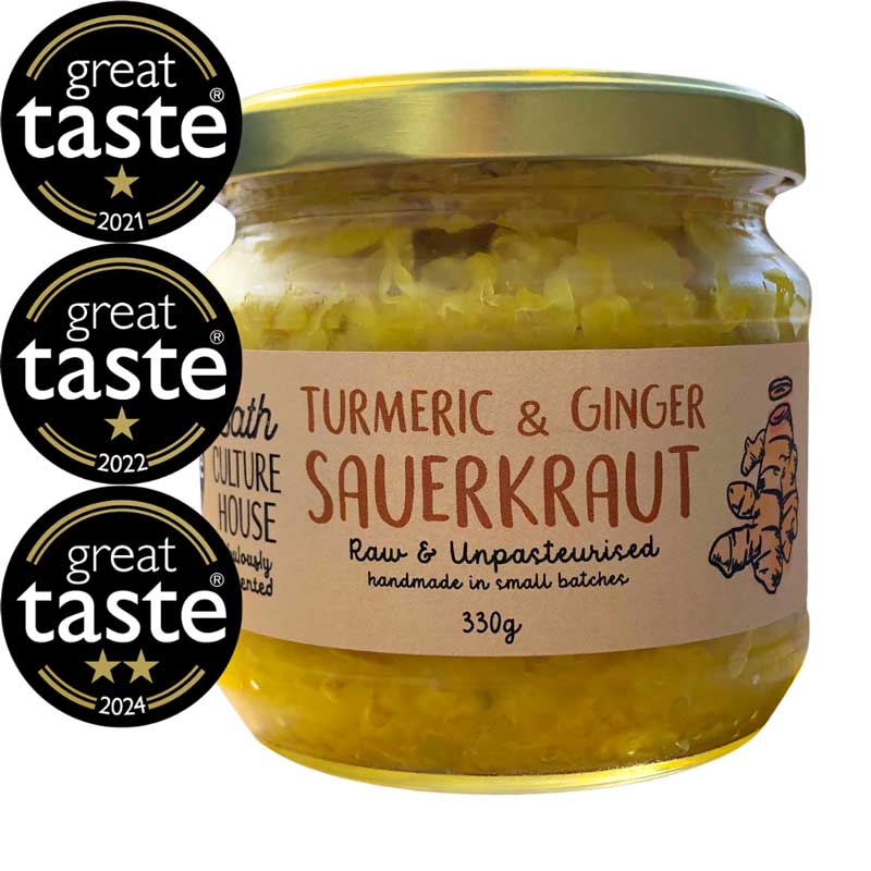A jar of Bath Culture House Turmeric and Ginger Sauerkraut with three Great Taste Award medals on a white background