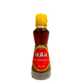 A 163ml bottle of Kadoya Hot Sesame Oil with a red label and yellow cap. Bottle on a white background.