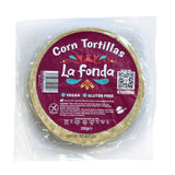 Packaged La Fonda corn tortillas with purple branding on a white background