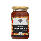 A 375g jar of Med Cuisine Red Shakshuka with black and white branding, a gold lid on a white background.