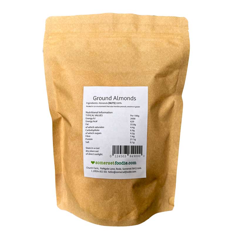 The reverse side of a Somerset Foodie pouch of Ground Almonds packed in a brown Kraft bag with a label on a white background