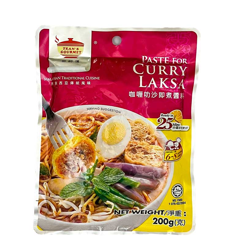 A 200g pack of Tean's Gourmet Paste for Curry Laksa showing a bowl of Malaysian laksa on the front of the pack.